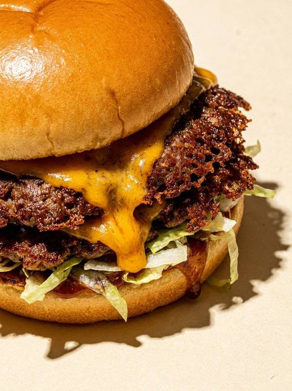 Double smash burger with melted cheddar and crispy edges